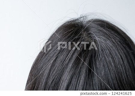 Close-up of white hair on top of head Close-up of white hair on top of head 124241625