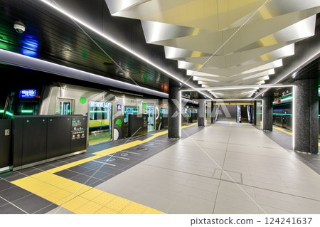 Platform at Yumeshima Station in Osaka Prefecture and a stopped Osaka Metro 30000A series train Platform at Yumeshima Station in Osaka Prefecture and a stopped Osaka Metro 30000A series train 124241637