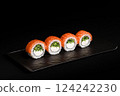 Delicious Fresh Salmon Sushi Rolls Presenting Exquisitely on a Black Background 124242230
