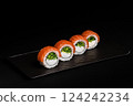 Delicious Fresh Salmon Sushi Rolls Presenting Exquisitely on a Black Background 124242234