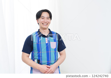 Smiling male nursery teacher Smiling male nursery teacher 124242740