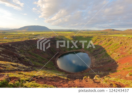 Sunset trekking around a beautiful crater lake Sunset trekking around a beautiful crater lake 124243437