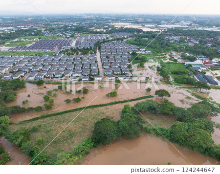 Tropical rainstorm flooded residential homes in suburban community in Chiang Mai, Thailand. 124244647