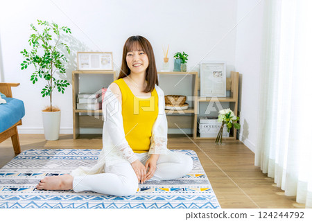 Young woman living alone in an apartment Young woman living alone in an apartment 124244792