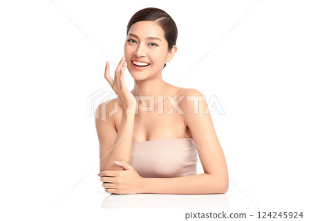 A beautiful young Asian woman with clean, fresh skin against a white background. Skincare, facial treatment, cosmetology, beauty, and spa. An elegant portrait of an Asian woman. A beautiful young Asian woman with clean, fresh skin against a white background. Skincare, facial treatment, cosmetology, beauty, and spa. An elegant portrait of an Asian woman. 124245924