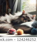 A cat sleeping on a pillow with sunlight coming through the window on its back. 124246252