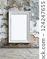 Rustic White Frame on Grungy Wall Background for Art Display 124247655