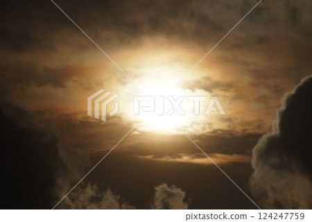The sun coming out of the clouds 124247759