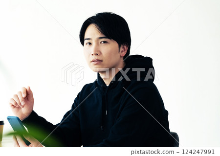 Young man thinking by the window 124247991