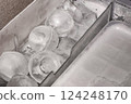 Ice cubes lined up in a refrigerator drawer: a glimpse of careful household life 124248170