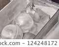 Ice cubes lined up in a refrigerator drawer: a glimpse of careful household life 124248172
