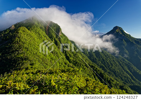 Clouds rising from Mt. Gongen and Mt. Aka seen from Mitsuto in the Yatsugatake mountain range 124248327