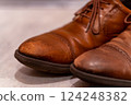 Details of leather shoes that show signs of use, realistic photos that give a sense of everyday life 124248382