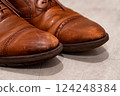 Details of leather shoes that show signs of use, realistic photos that give a sense of everyday life 124248384