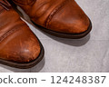 Details of leather shoes that show signs of use, realistic photos that give a sense of everyday life 124248387