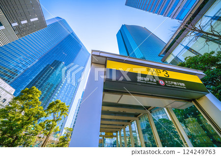Tokyo cityscape in Japan: A station directly beneath the skyscrapers of Shiodome. A view of Shiodome Station Exit 3 on the Oedo Line, etc. ... Towards a new era 124249763
