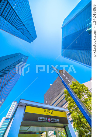 Tokyo cityscape in Japan: A station directly beneath the skyscrapers of Shiodome. A view of Shiodome Station Exit 4 on the Oedo Line, etc. ... Towards a new era 124249869
