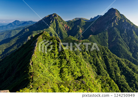 The main peaks of the Yatsugatake mountain range seen from Mt. Gongen in summer The main peaks of the Yatsugatake mountain range seen from Mt. Gongen in summer 124250949