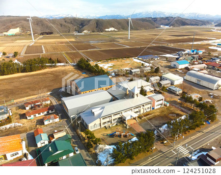 Aerial view of Esashi Town's Esashi Kita Elementary and Junior High School in early spring in Esashi Town, Hokkaido 124251028