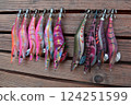 Use different colors of lures to catch bigfin reef squid. 124251599
