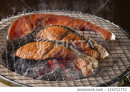 Delicious salmon grilled on a charcoal grill 124252752