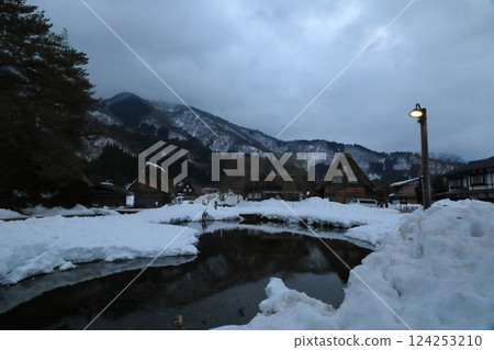 As the sun sets, the street lights come on in the Ogimachi Gassho-style village of Shirakawa-go. As the sun sets, the street lights come on in the Ogimachi Gassho-style village of Shirakawa-go. 124253210