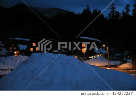 Night view of Ogimachi Gassho-style village in Shirakawa-go, with lights shining on the Gassho-style houses Night view of Ogimachi Gassho-style village in Shirakawa-go, with lights shining on the Gassho-style houses 124253227
