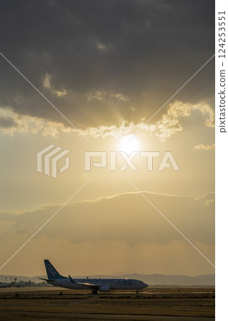Sendai Airport at dusk, plane taxiing, Natori City, Miyagi Prefecture 124253551