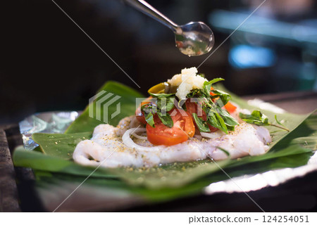 Nicaraguan food, fish on dried banana leaf, Nicaraguan gastronomy, Nicaraguan dishes 124254051
