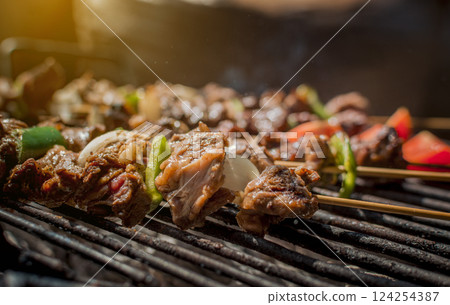 Roast beef skewers on a grill, Roast beef skewers grilling on a grill, Roast beef concept Roast beef skewers on a grill, Roast beef skewers grilling on a grill, Roast beef concept 124254387