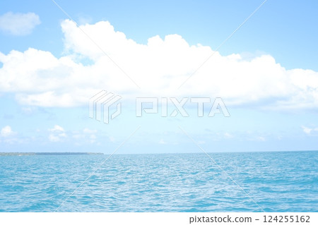 a serene seascape with a vast expanse of blue ocean stretching toward the horizon 124255162