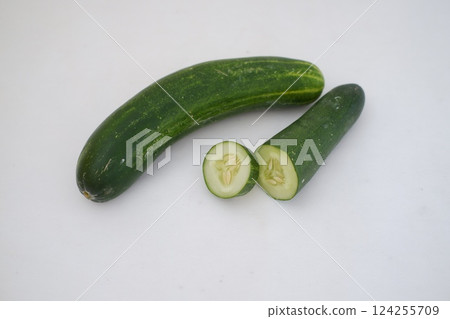 Cucumber and slices on a white background. Selective focus. 124255709