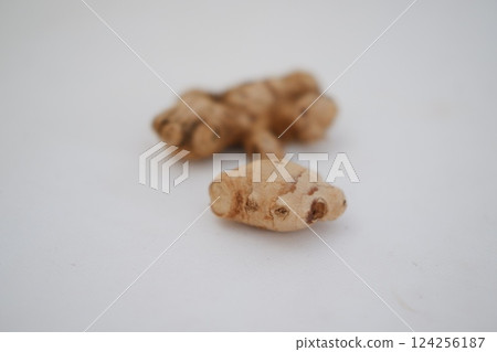 Turmeric (Curcuma longa Linn) rhizome (root) sliced isolated on white background. Turmeric (Curcuma longa Linn) rhizome (root) sliced isolated on white background. 124256187