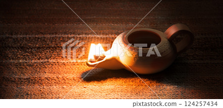 Ancient lamp shines in the dark Ancient lamp shines in the dark 124257434