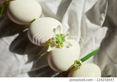Eggs arranged with delicate flowers Eggs arranged with delicate flowers 124258047