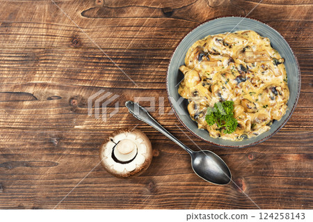 Mushrooms in cream sauce. 124258143