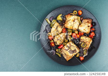 Roasted fish fillet and baked vegetables. Roasted fish fillet and baked vegetables. 124258149