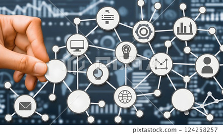 Hand arranging network nodes with digital icons, representing data integration, connectivity, and technology solutions. 124258257