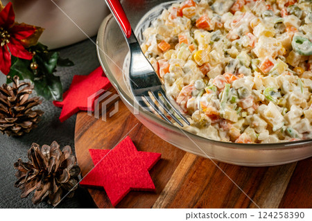 Traditional salad with cooked vegetables with mayonnaise. Traditional salad with cooked vegetables with mayonnaise. 124258390