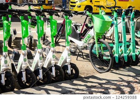 Lime electric scooters parked in historic centre of Prague, capital of Czech Republic 124259388