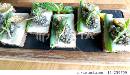 Black bread with butter and black caviar Black bread with butter and black caviar 124259709