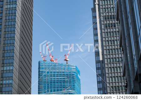 Skyscraper cityscape with skyscrapers under construction 124260068
