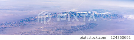 Kunlun Mountain Range in the Tibetan Plateau in China. Panorama of snow-capped mountains in the Himalayas airplane view Kunlun Mountain Range in the Tibetan Plateau in China. Panorama of snow-capped mountains in the Himalayas airplane view 124260691