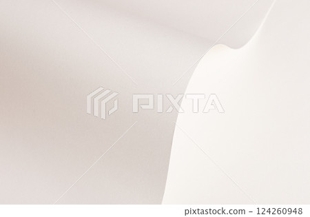 White and beige paper background with a creamy texture and wavy edges. Warm off-white tones, thin 124260948