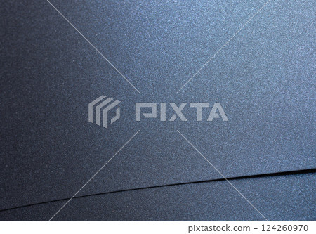 Navy blue paper background with a smooth, glossy texture and a pearlescent finish. Deep, rich tones Navy blue paper background with a smooth, glossy texture and a pearlescent finish. Deep, rich tones 124260970