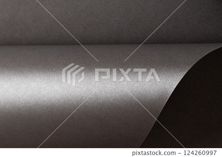 Gray metallic paper background with a pearlescent, glossy texture. Subtle silver tones create an Gray metallic paper background with a pearlescent, glossy texture. Subtle silver tones create an 124260997