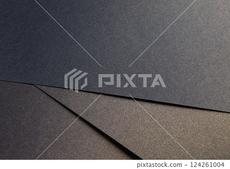 Elegant paper texture with a rich blend of blue, black, and golden tones. Shimmering, grainy surface Elegant paper texture with a rich blend of blue, black, and golden tones. Shimmering, grainy surface 124261004