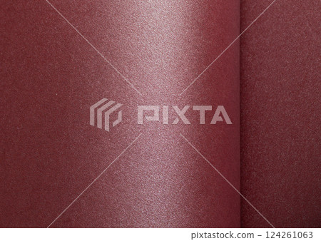 Elegant dark burgundy paper texture with a pearlescent gloss and shimmering finish. Rich and 124261063