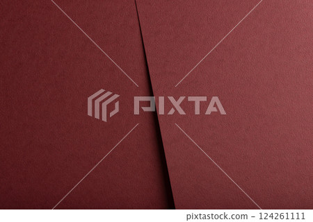 Deep burgundy paper background with a matte, grainy texture and subtle fibrous surface. Rich red Deep burgundy paper background with a matte, grainy texture and subtle fibrous surface. Rich red 124261111