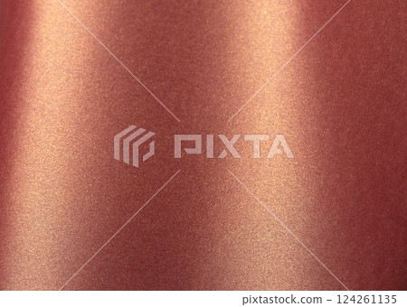 Burgundy paper background with a glossy, pearlescent texture and shimmering metallic finish. Warm, 124261135